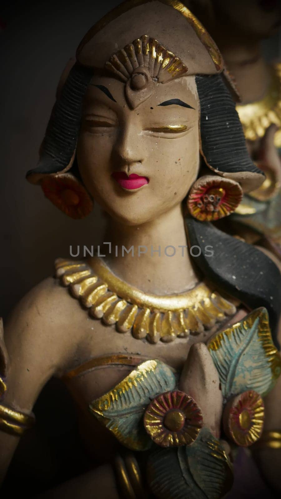 Beautiful artistic statue of a Balinese or javanese dancer used as garden decoration, javanese gnome indonesia asian garden statue