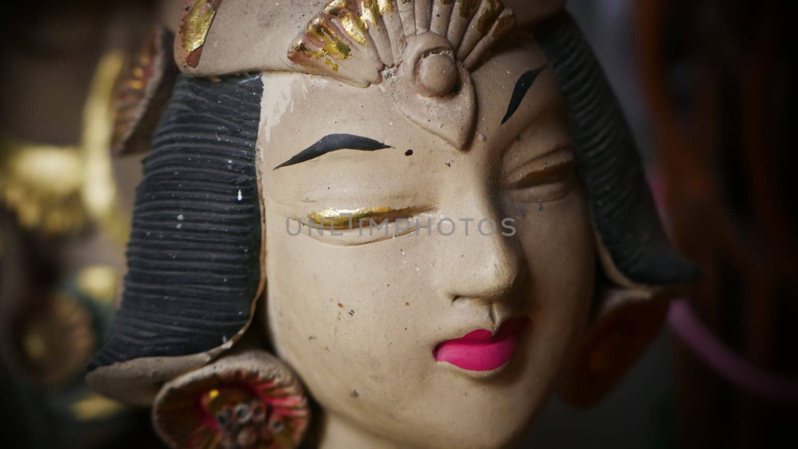 Beautiful artistic statue of a Balinese or javanese dancer used as garden decoration, javanese gnome indonesia asian garden statue