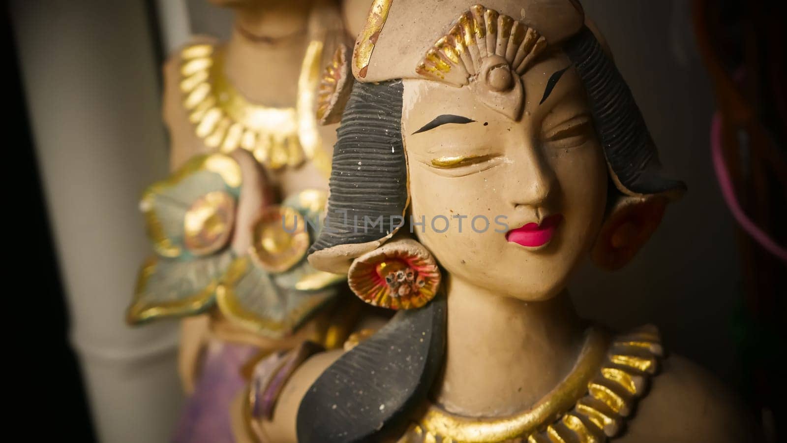Beautiful artistic statue of a Balinese or javanese dancer used as garden decoration, javanese gnome indonesia asian garden statue