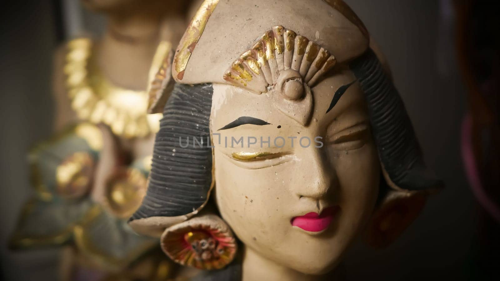 Beautiful artistic statue of a Balinese or javanese dancer used as garden decoration, javanese gnome indonesia asian garden statue