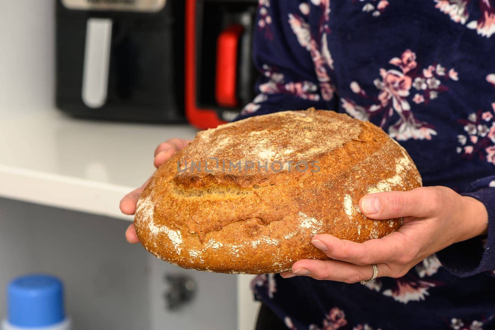 appetizing homemade whole grain bread in the hands of a woman 5