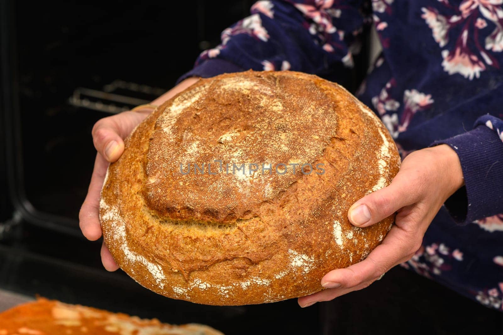 appetizing homemade whole grain bread in the hands of a woman 8