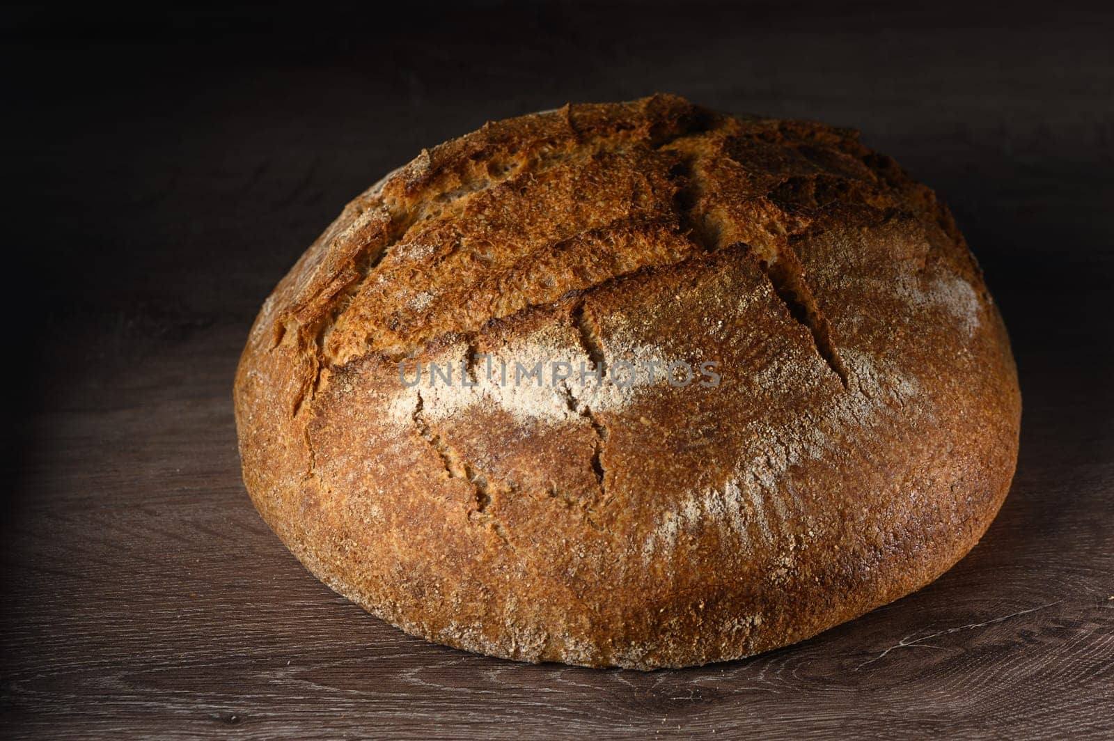 appetizing homemade whole grain bread on a wooden table 11