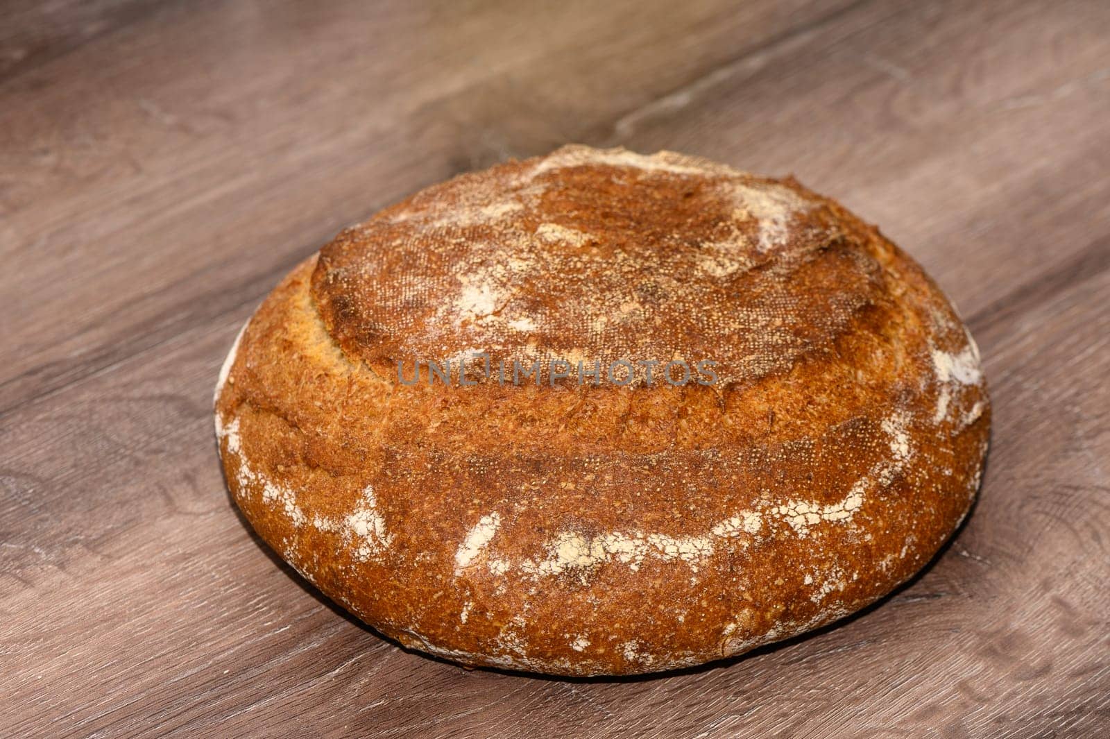 appetizing homemade whole grain bread on a wooden table 3