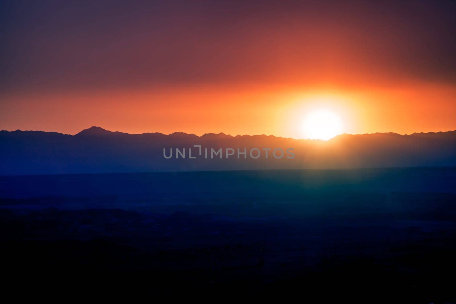 Sunset over mountain ridge. by AlexPurple