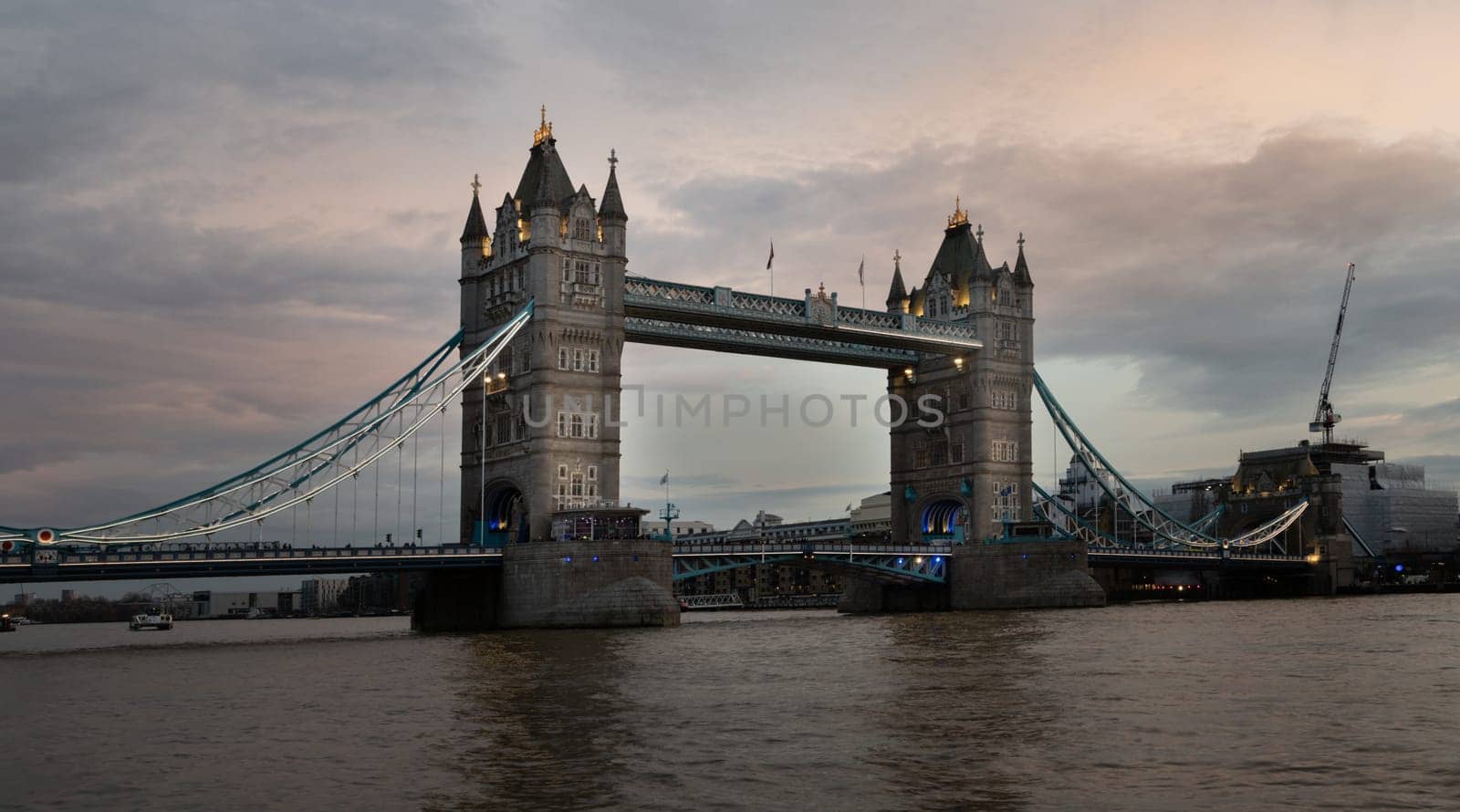 London, UK - Feb 15, 2024 - Panorama view of famous Tower bridge and skyline in the river thames at evening. Copy space, Selective focus.