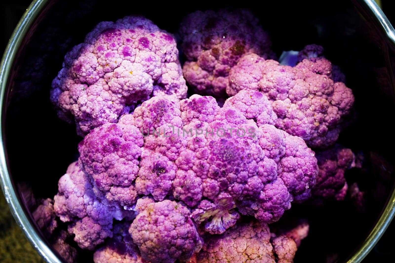 Raw purple cauliflower in a saucepan by GemaIbarra