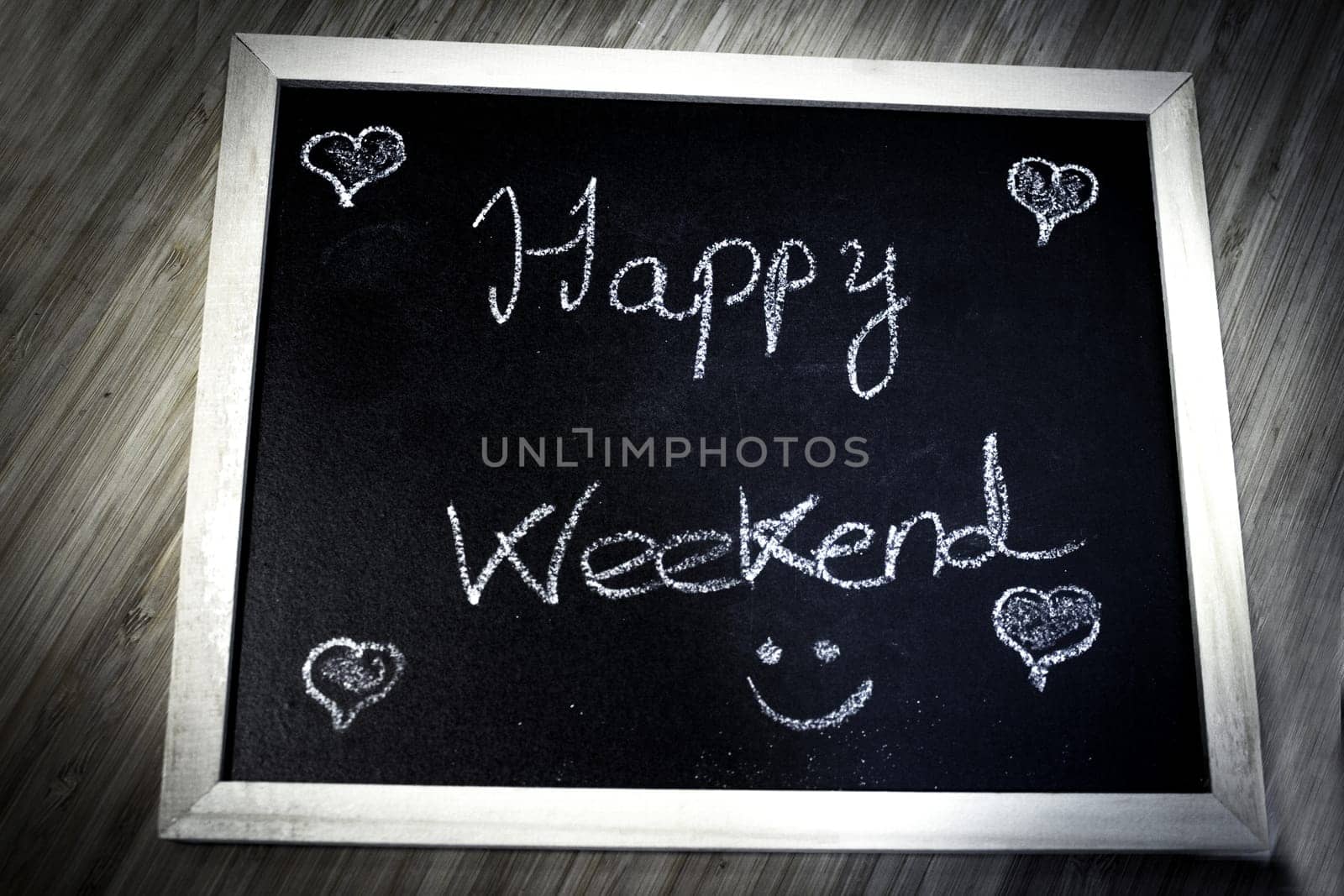 Happy weekend written with chalk. No copy space