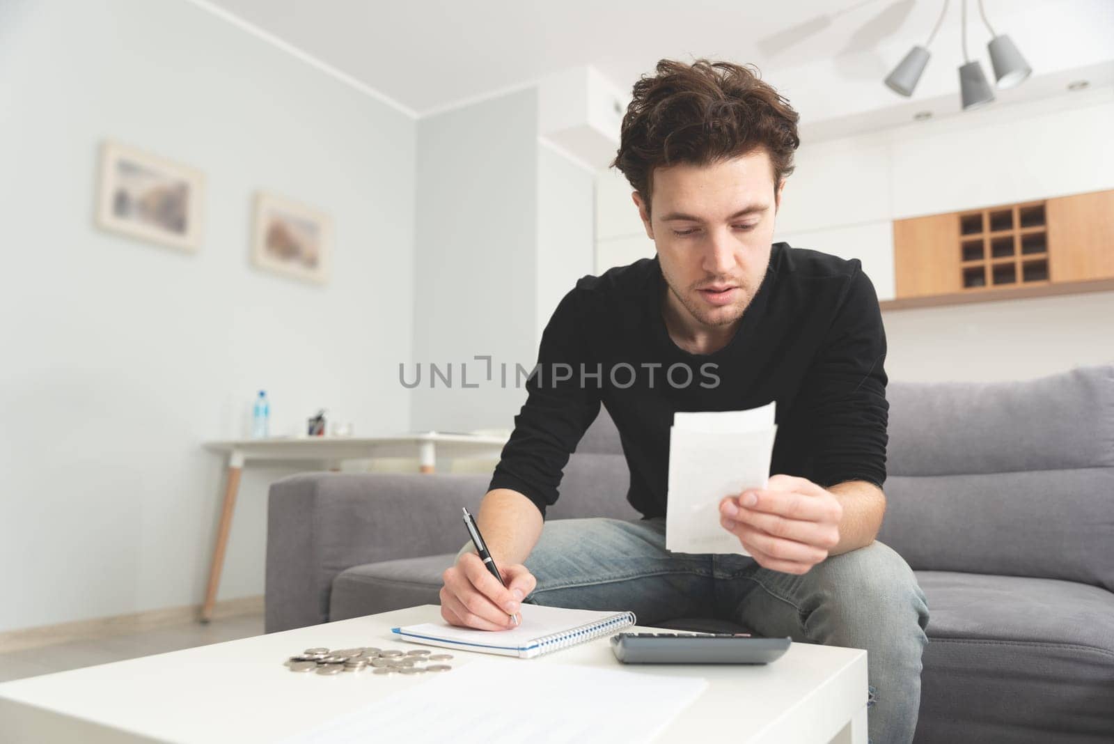 Man holding receipt, making financial revision by simpson33