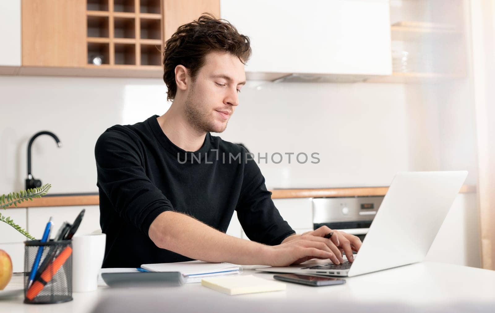Young man working at home. Home office, remotely working concept