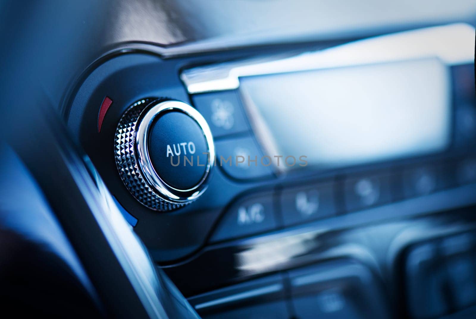 Air conditioner control panel, car cooling system. Close up photo of front panel with AC knob