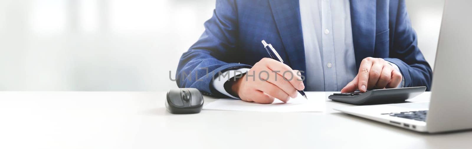 Businessman working in office. Analyst, bookkeeper concept, wide image with copy space