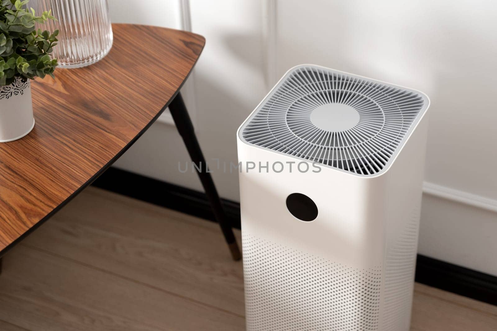 Air purifier in living room, dust protection by simpson33