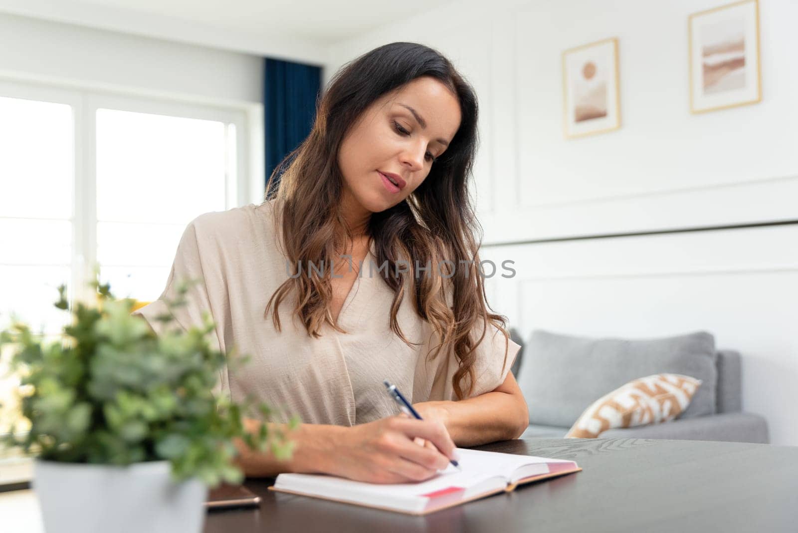 Attractive, beautiful woman working at home by simpson33