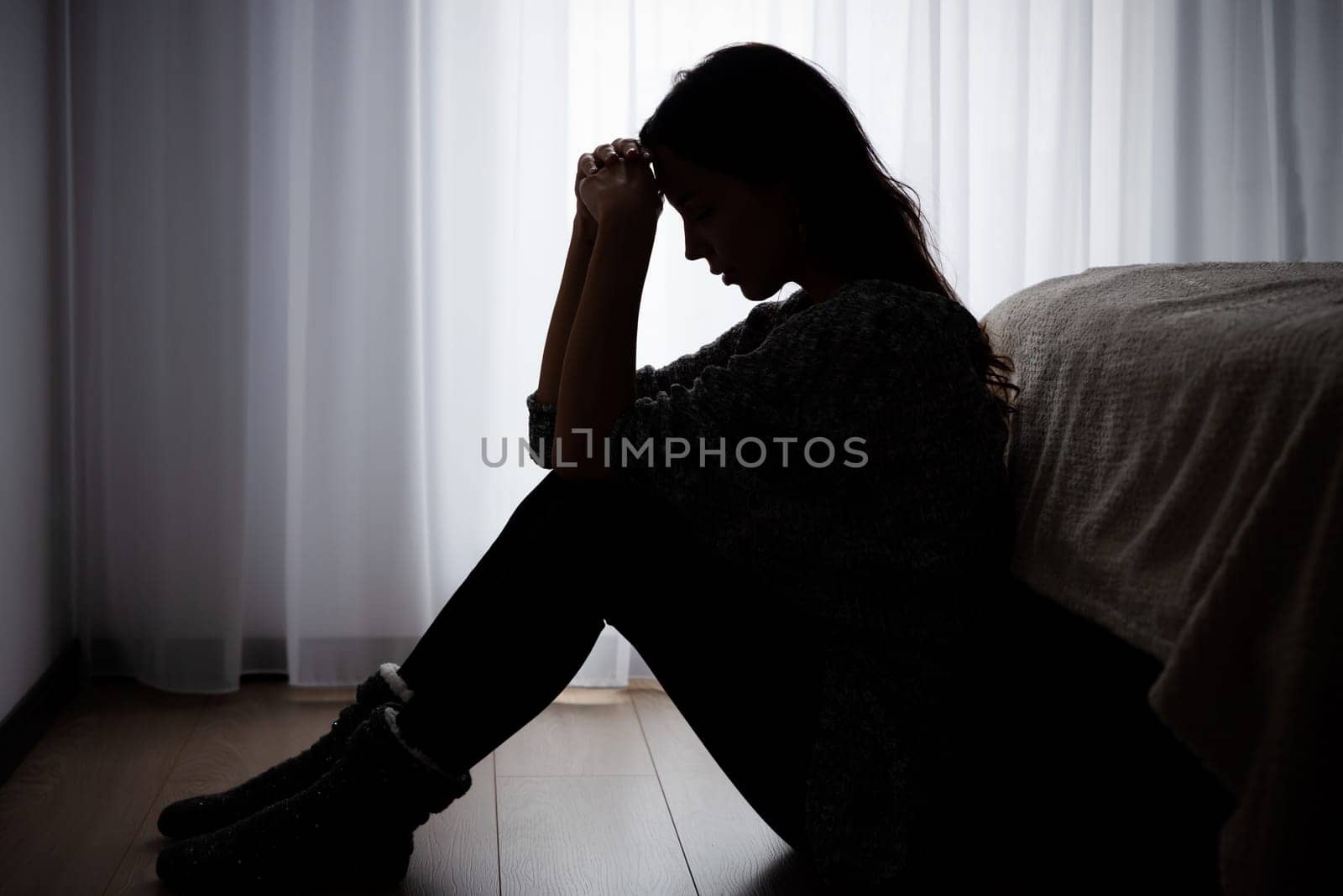 Woman suffering from depression. Sadness and headache concept