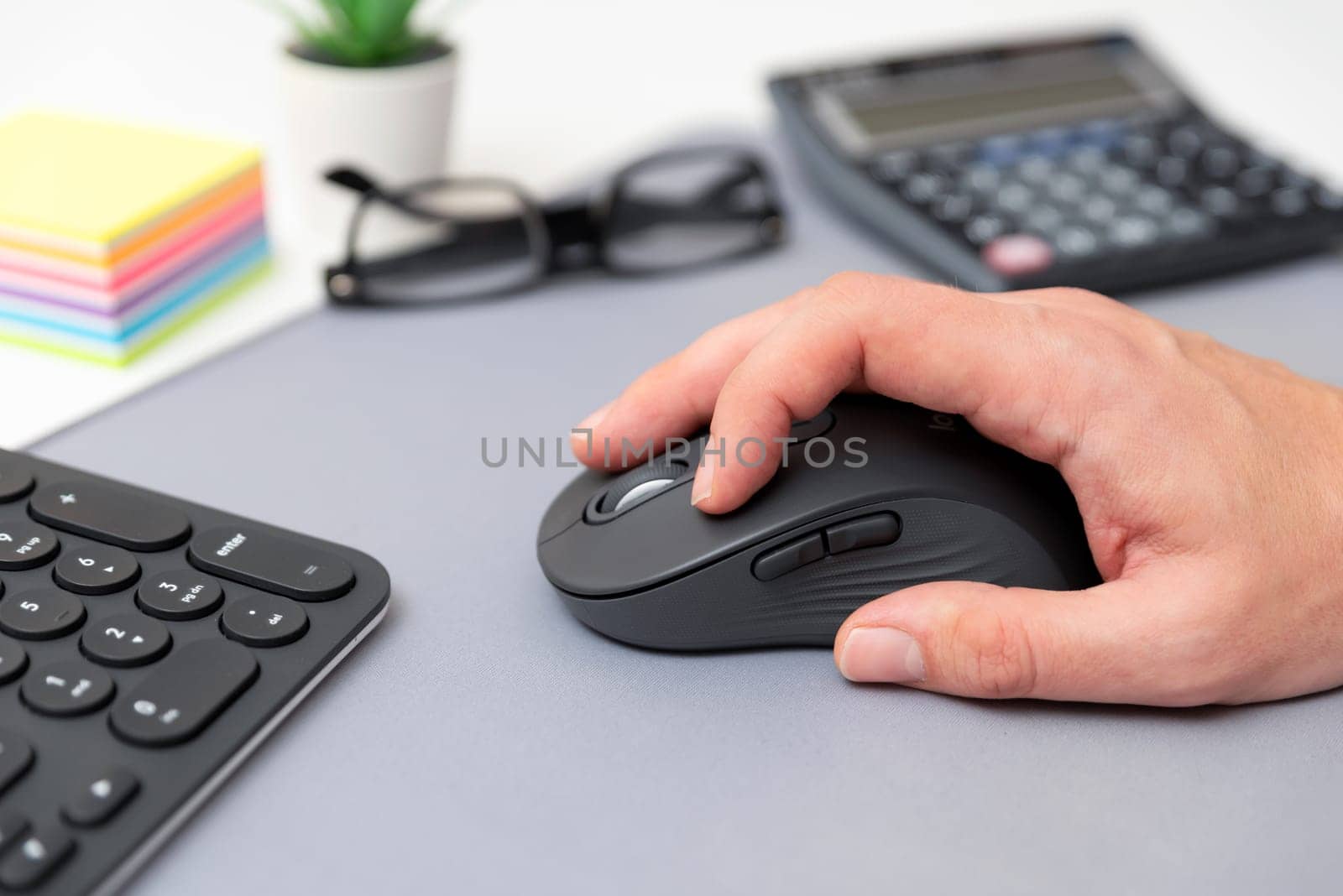 Man using computer mouse. Working at the office