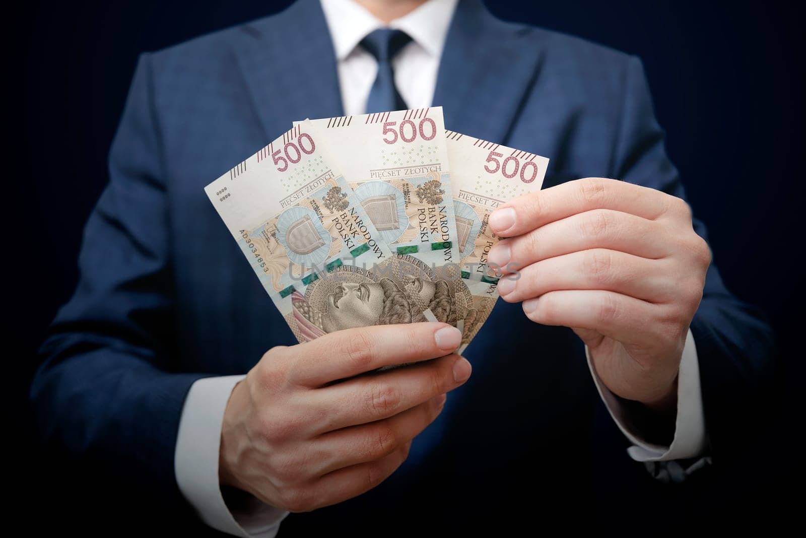 Polish 500 PLN banknotes in hand, polish currency