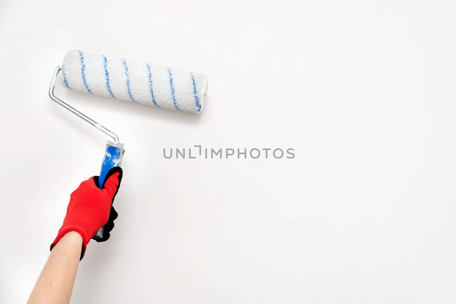 Close up of painter, roller painting. Painting, renovation walls