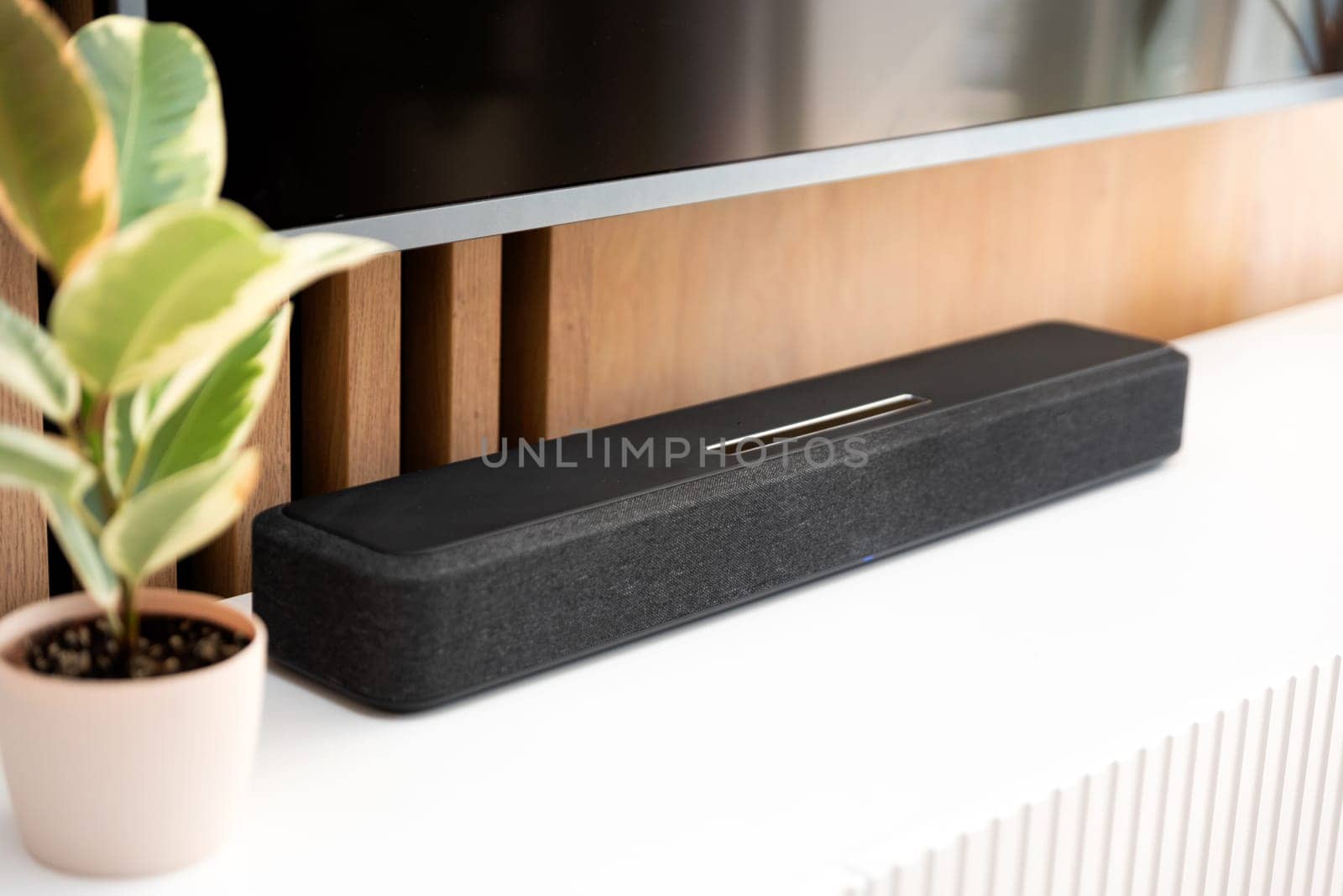 Soundbar in a modern home. Listening to music by simpson33