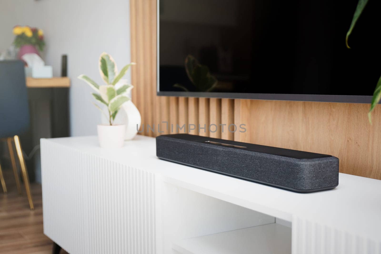 Soundbar in a modern home. Listening to music in living room