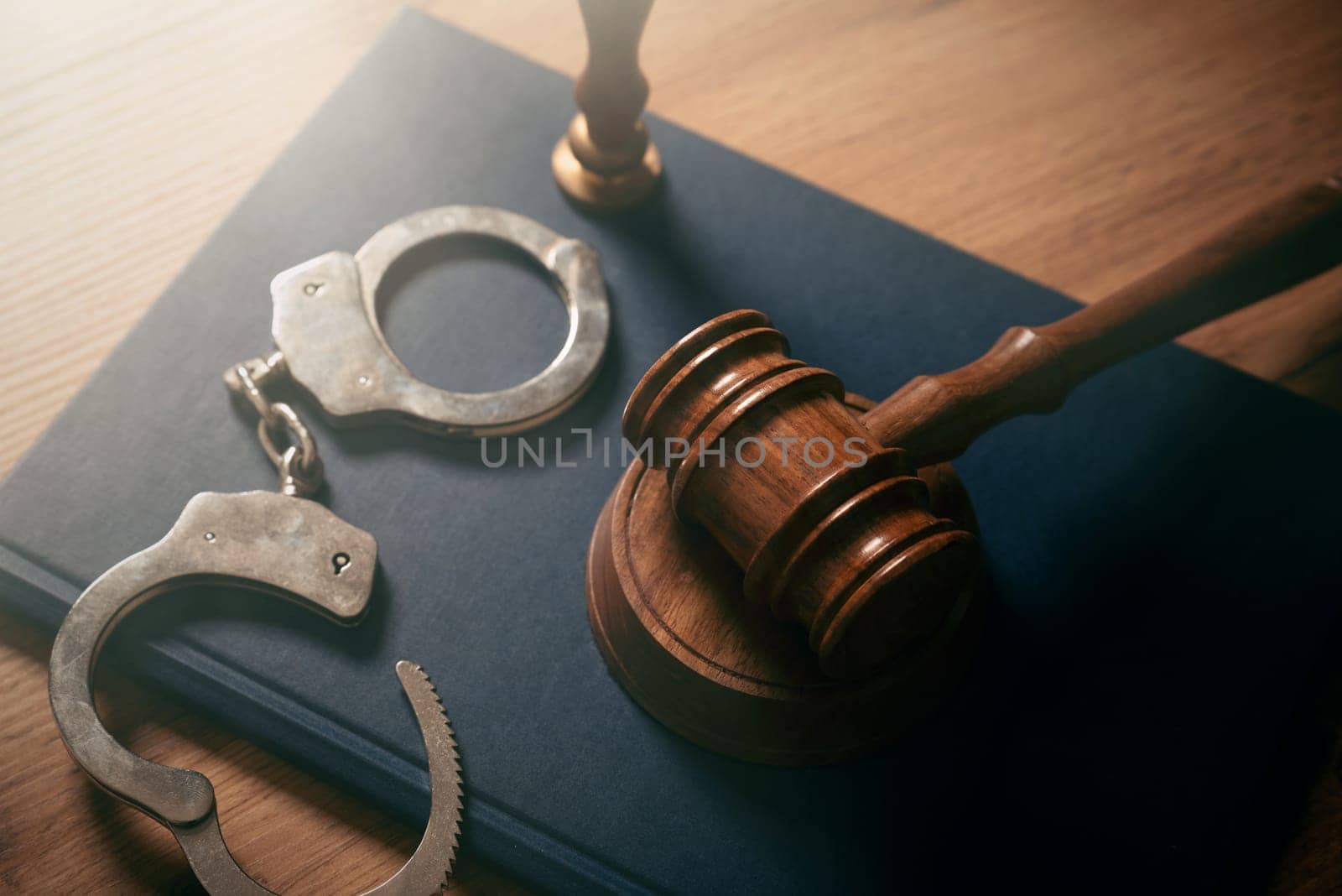 Handcuffs and wooden gavel. Crime, legal and violence concept.