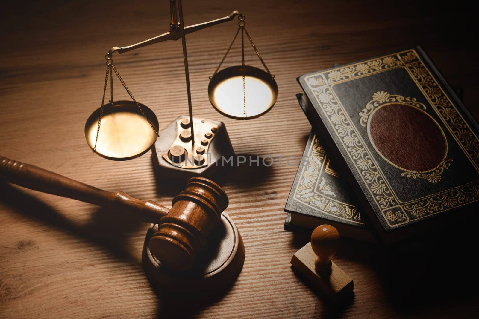 Judge gavel and legal book on wooden table, justice and law concept
