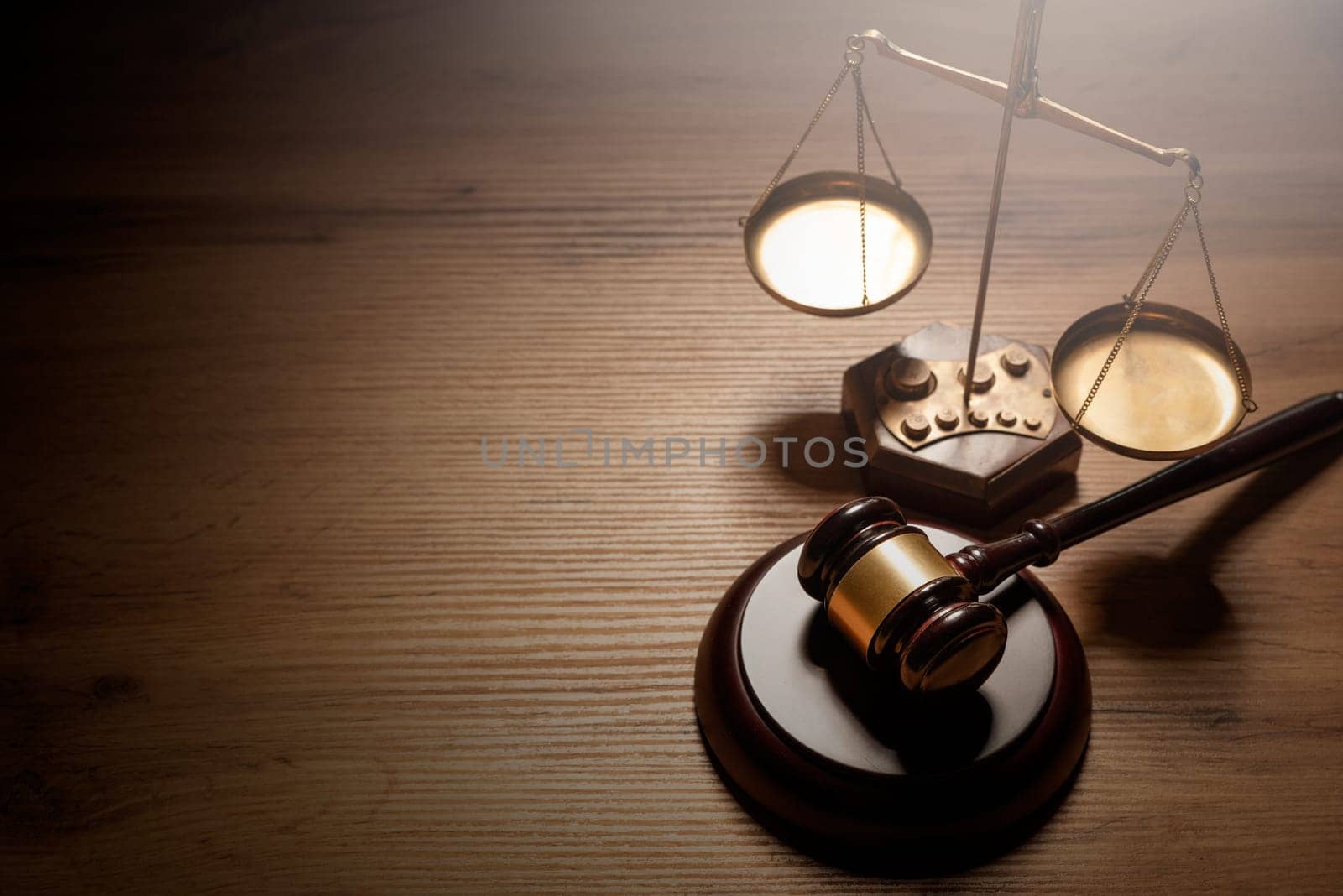 Judge gavel and weight scale on wooden table by simpson33