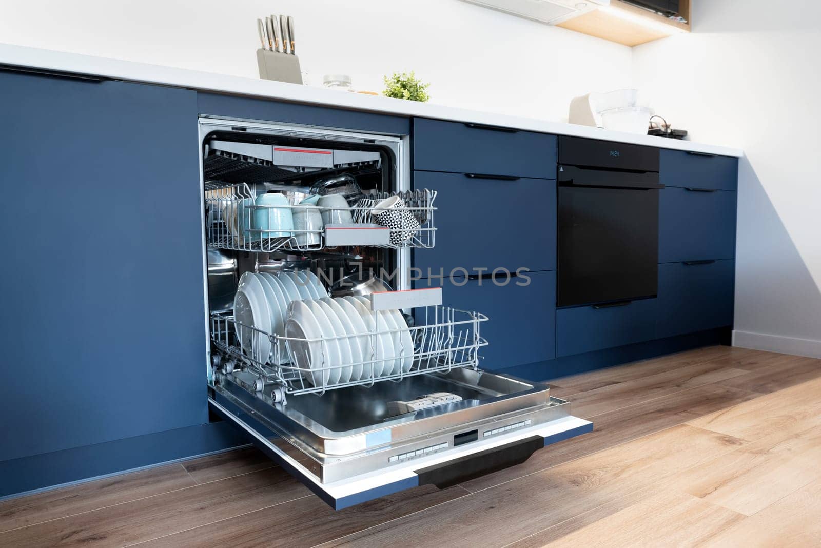 Dishwasher in modern kitchen. Perfectly washing dishes