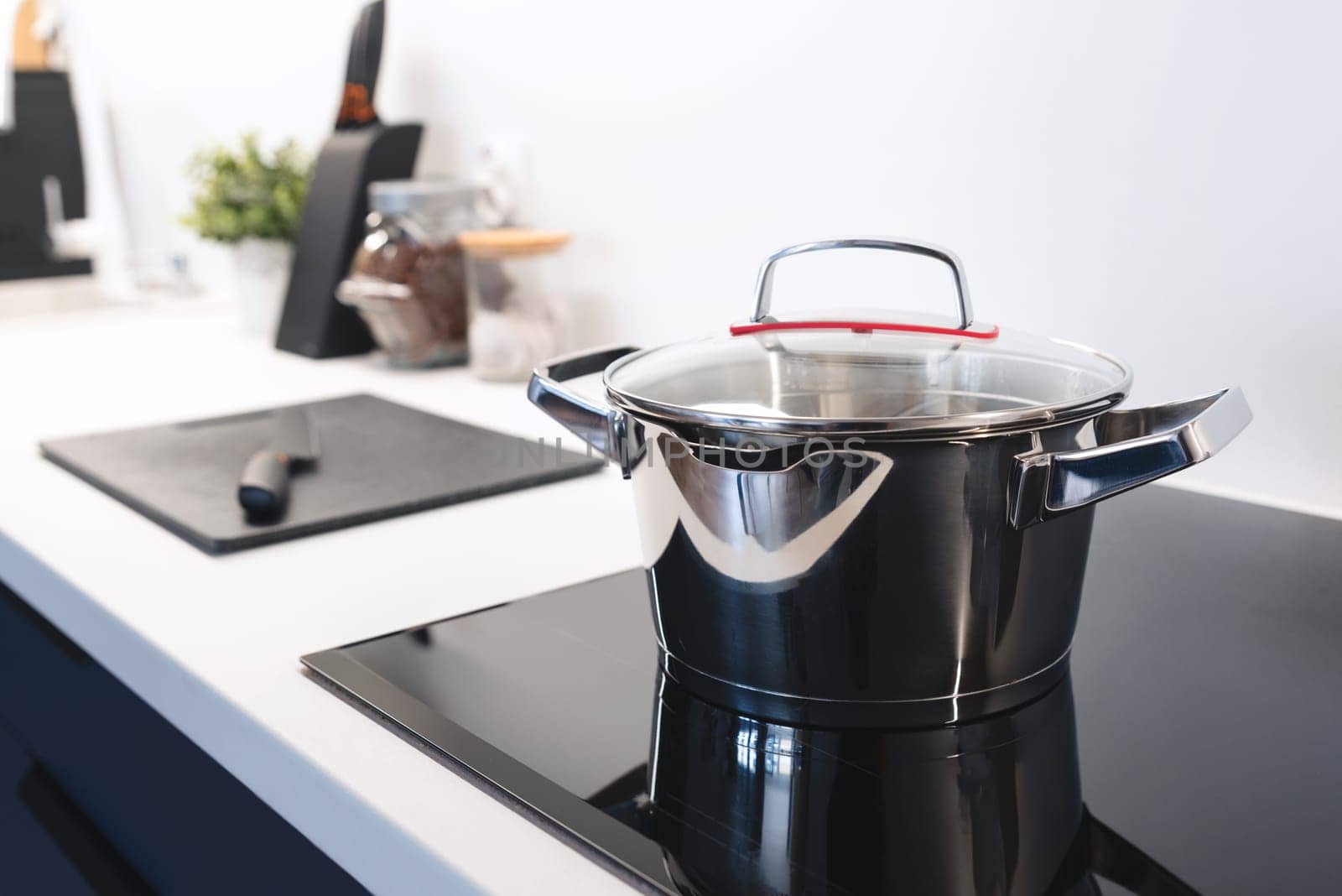 Stainless pan on the hob, cooking on a induction stove, clean cookware