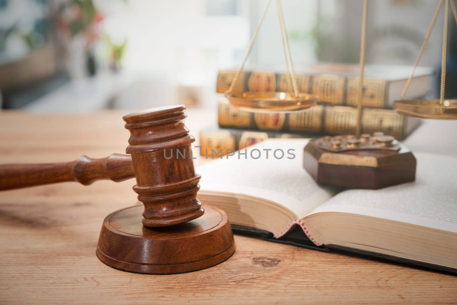 Wooden gavel with books in background by simpson33
