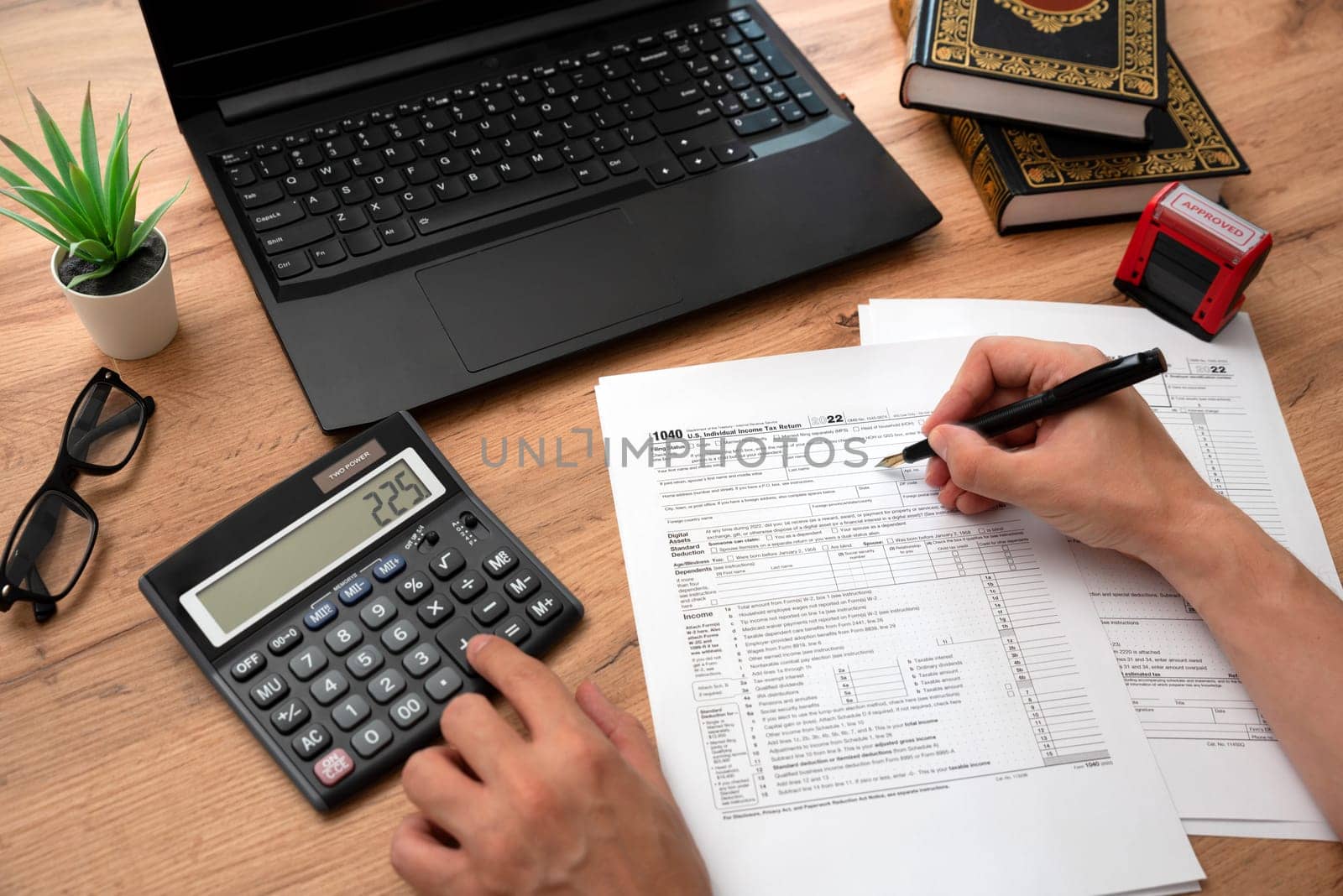 Man filling US tax forms, individual income tax return form