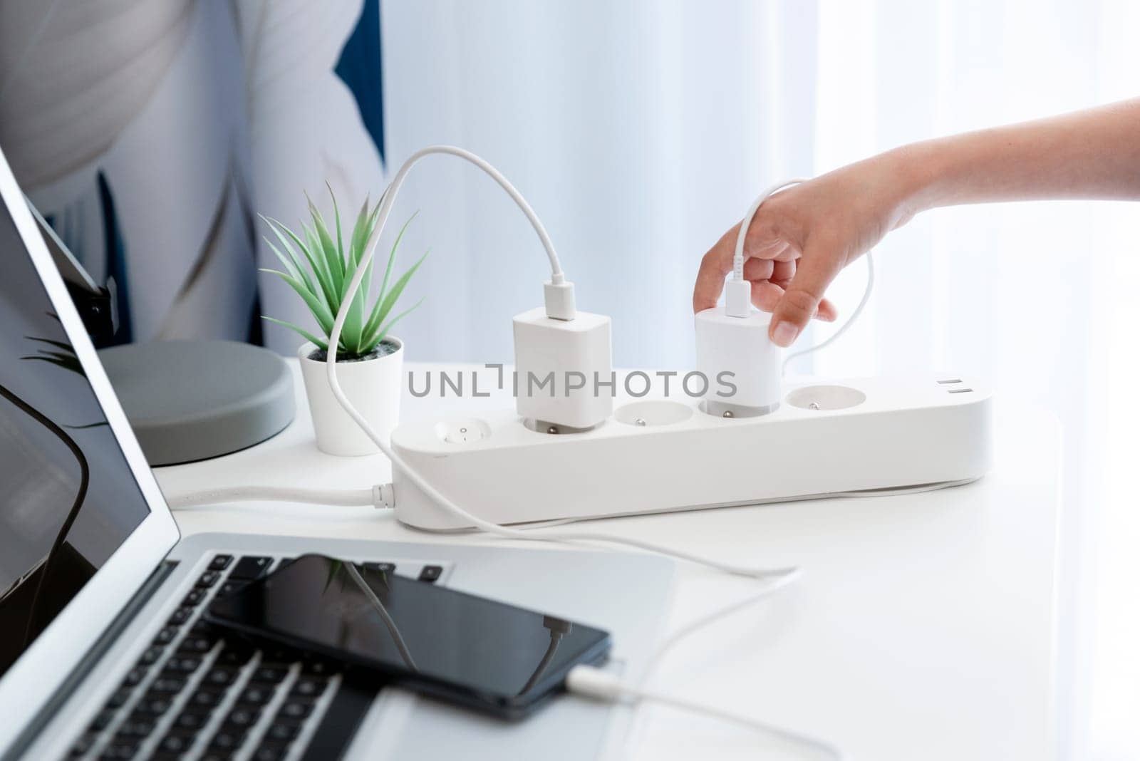 Electrical plug in outlet socket at home. Electrical equipment, electrical wires and power strips in the house