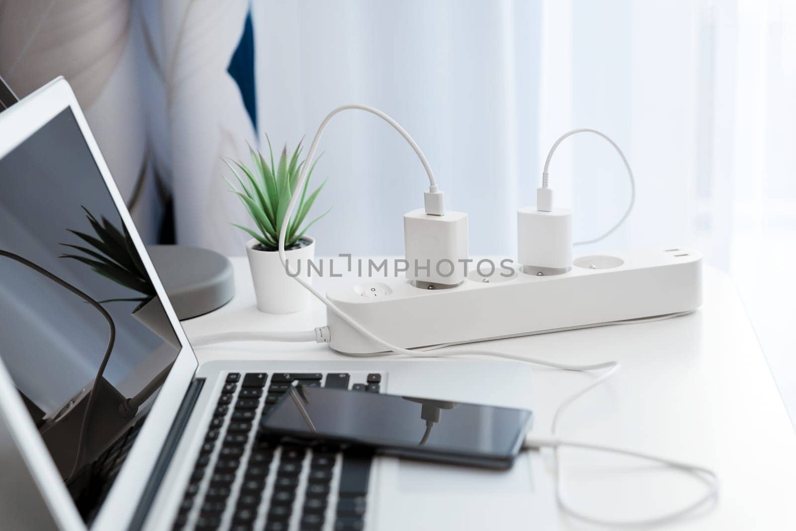 Electrical plug in outlet socket at home. Electrical equipment, electrical wires and power strips in the house
