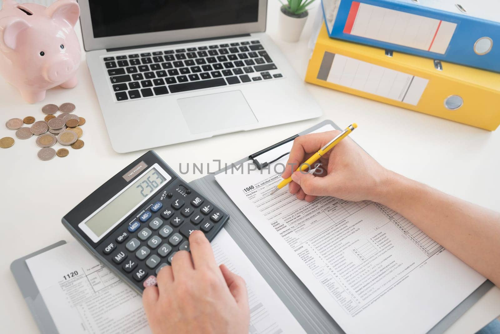 Tax income concept with filling US tax forms on desk