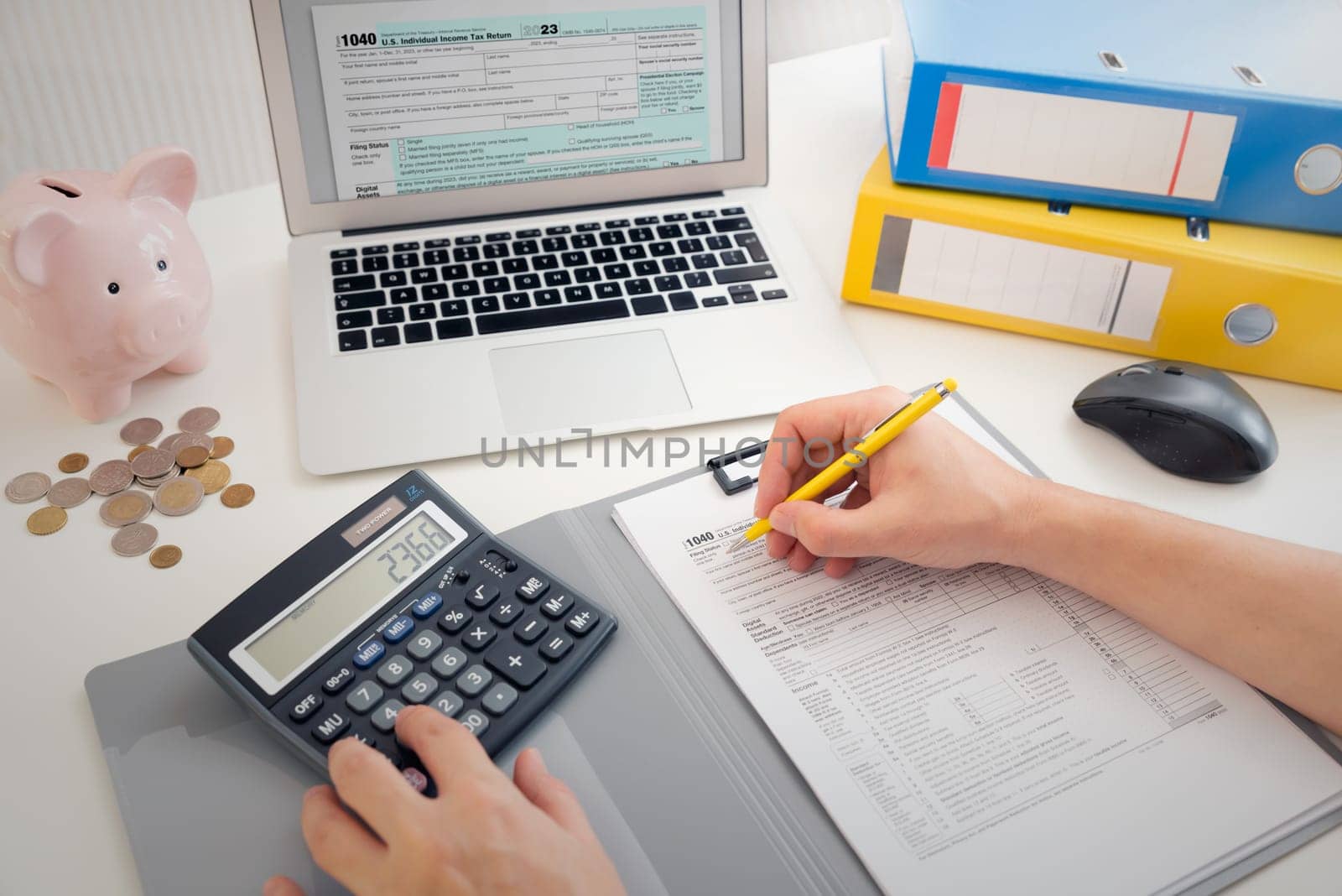 Income tax concept with laptop and US tax forms