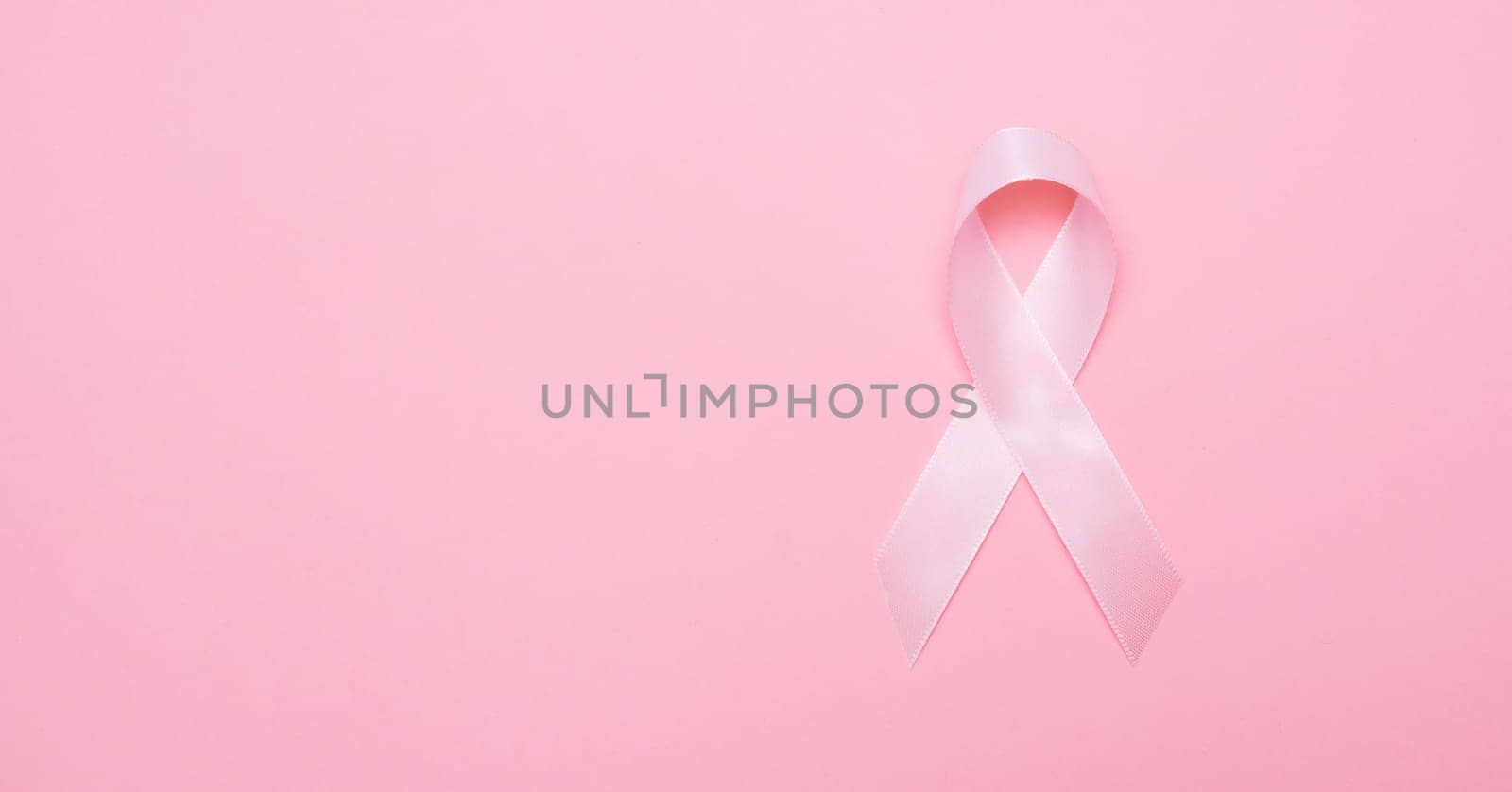 Pink breast cancer awareness ribbon, copy space by simpson33