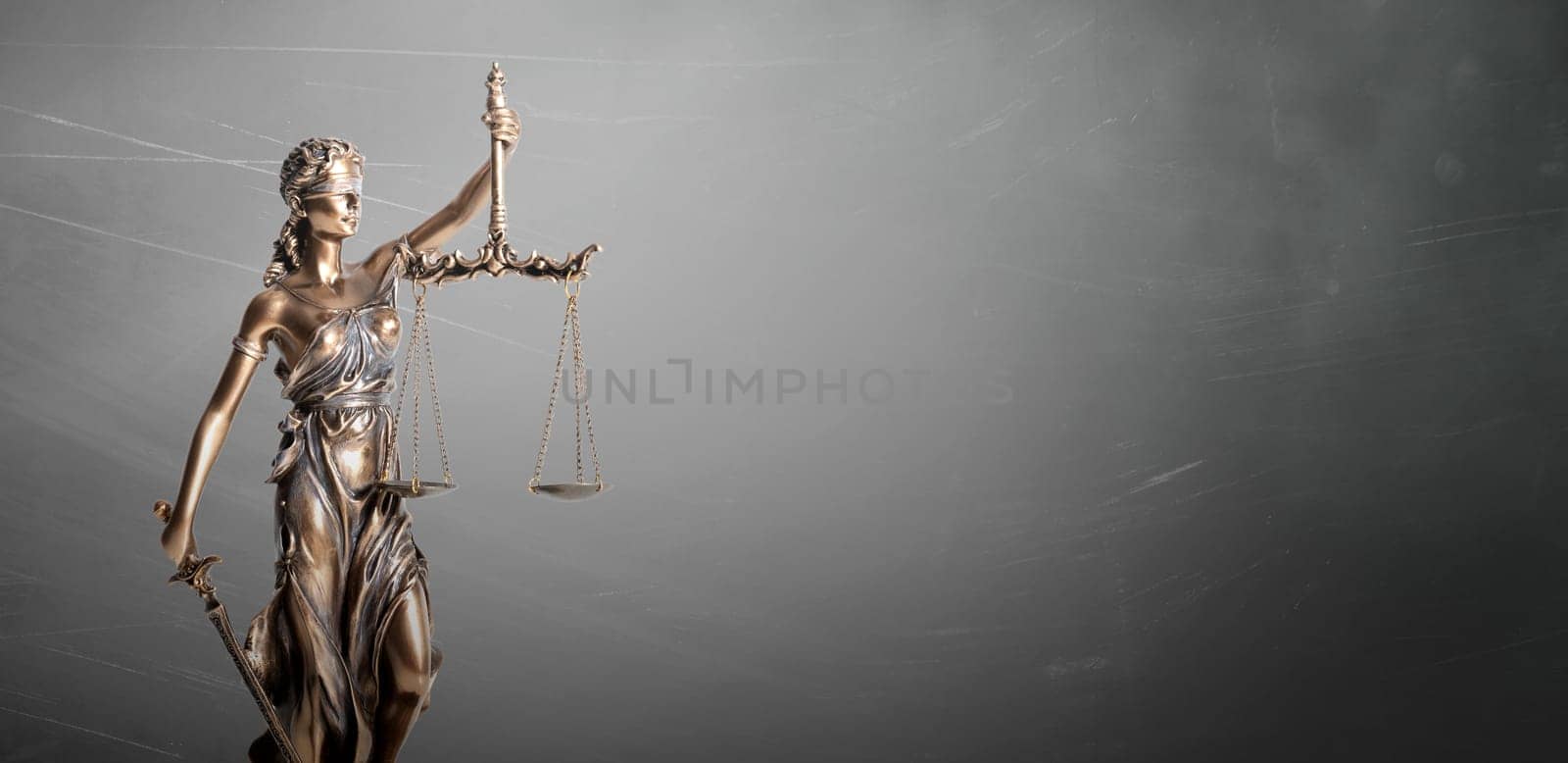 Blind justice symbol on a metallic statue. Law and justice concept, copy space