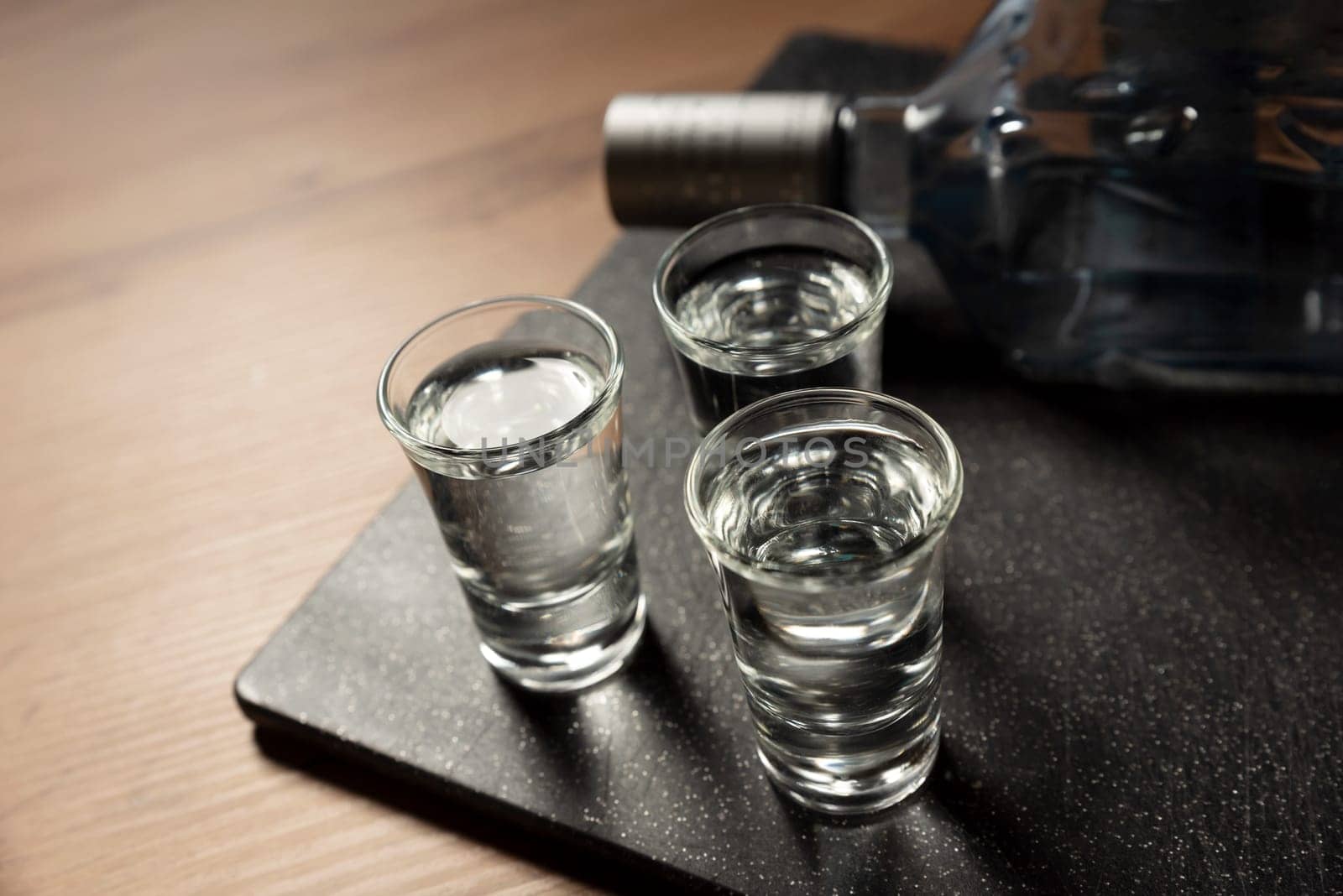 Glasses with vodka on the table. Alcohol closeup