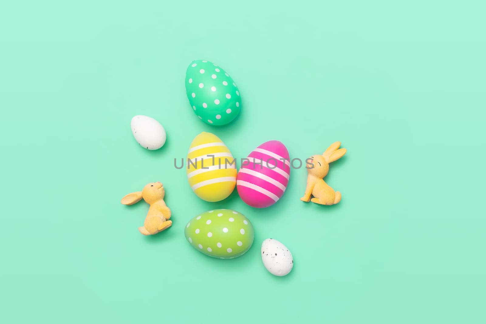 Easter eggs and bunnies concept gift card, green background