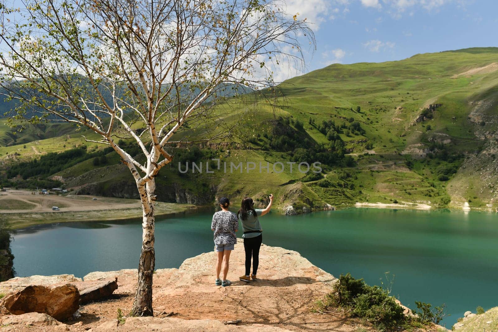 Turquoise lake Gizhgit in the village Bylym by Godi