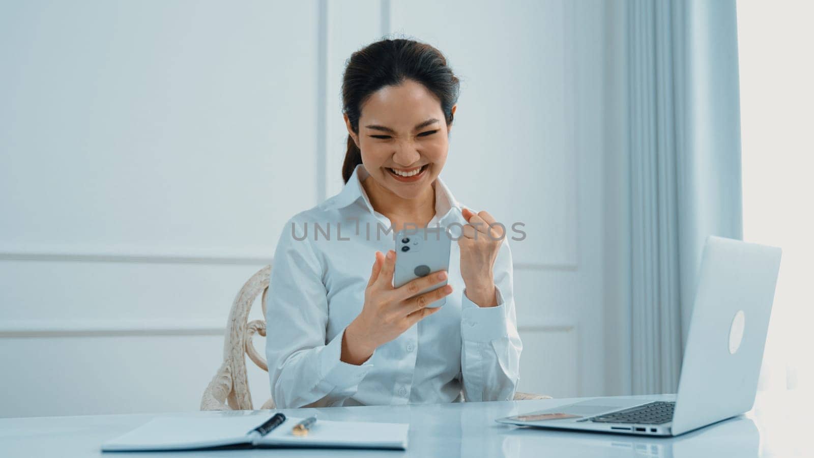 Young woman using smartphone browsing for online shopping E commerce by online payment gateway at vivancy home. Modern and convenience online purchasing make secure and convenient purchases.