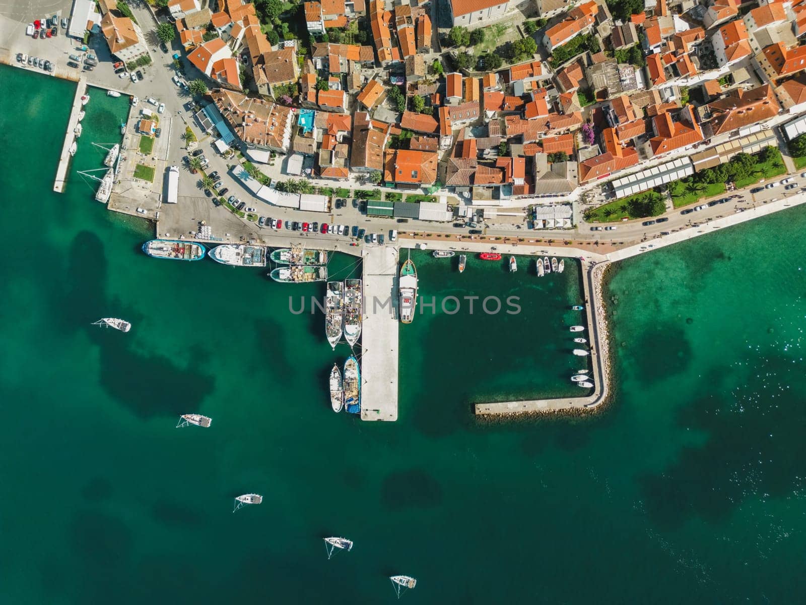 Biograd na Moru, aerial above view of city port with beautiful architecture and sailing boats and luxury yachts at stone pier. Scenic historic harbor on Adriatic Sea coast, Dalmatia region in Croatia