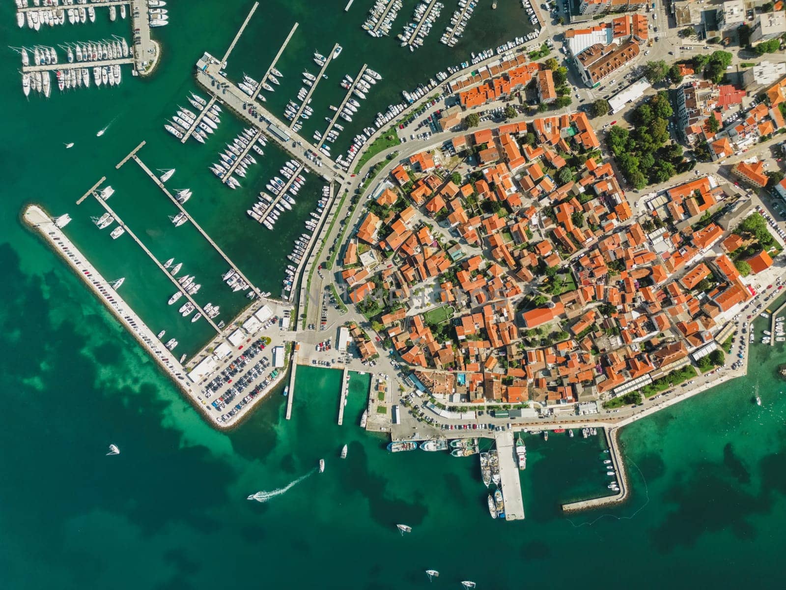 Biograd na Moru, aerial above marina view with ships and yachts at pier in row. Old European architecture in summer port, travel destination on Adriatic Sea coast, Dalmatia region of Croatia