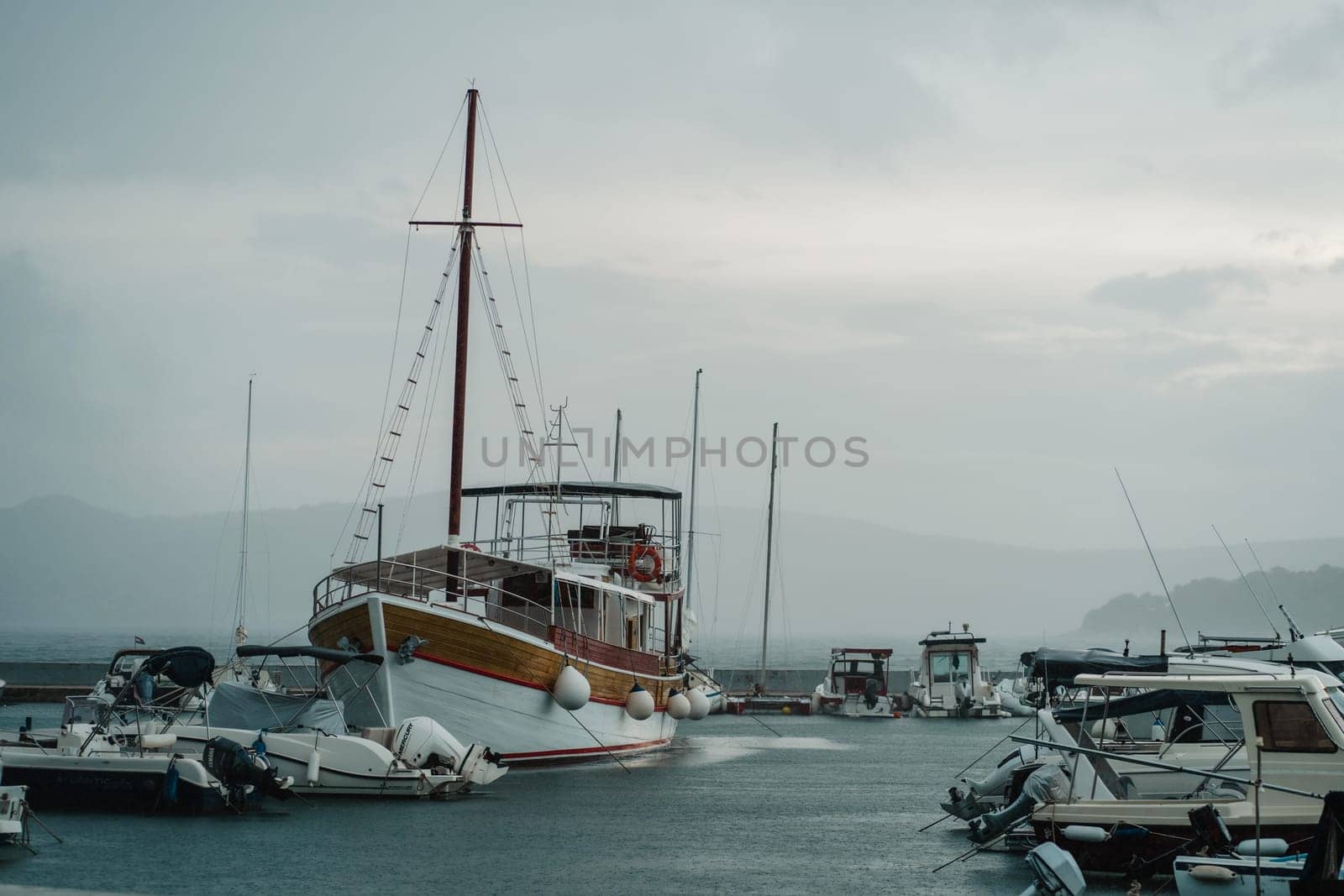 Sloop rigged sailboats moored to pier in yacht marina, Biograd na Moru of Croatia