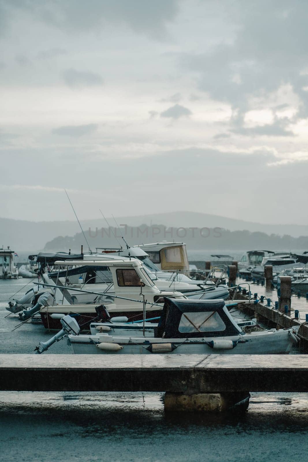 Old and modern boats at wooden pier in Biograd na Moru of Croatia by Popov