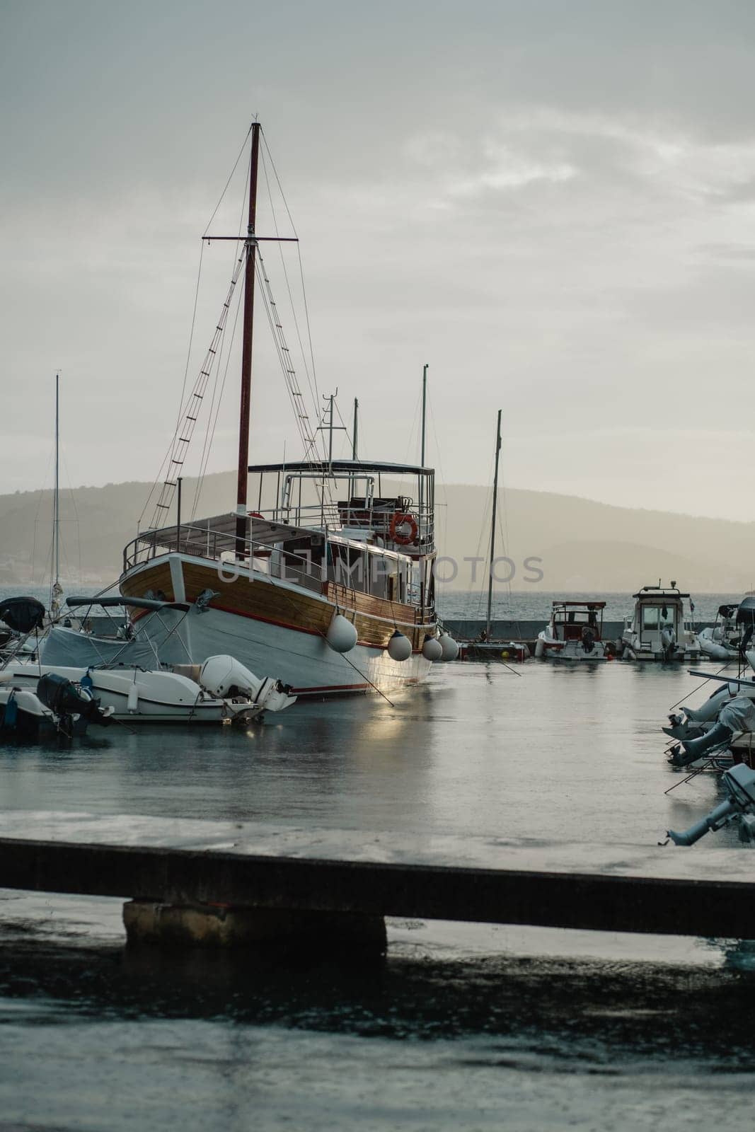 Retro traditional sailboat and motor boats for rent or sale at pier of Biograd na Moru of Croatia