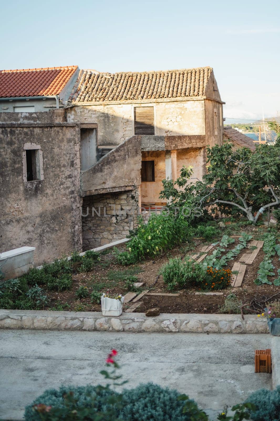 Old stone street of Biograd na Moru port in Croatia by Popov