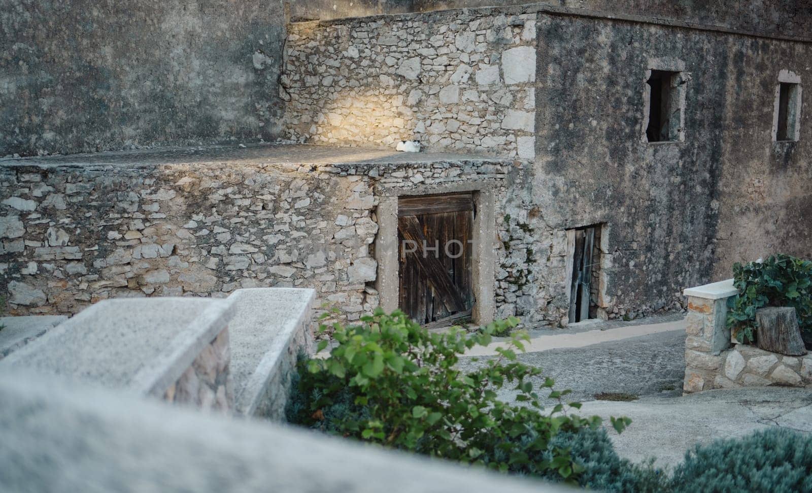 Abandoned stone house on street of Old Town, Biograd na Moru port in Croatia