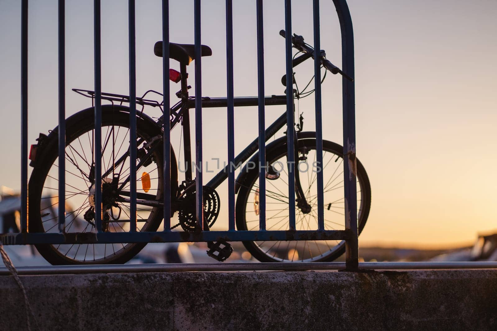 Bike parking at sunset pier of Biograd na Moru port in Croatia, summer vacation transport