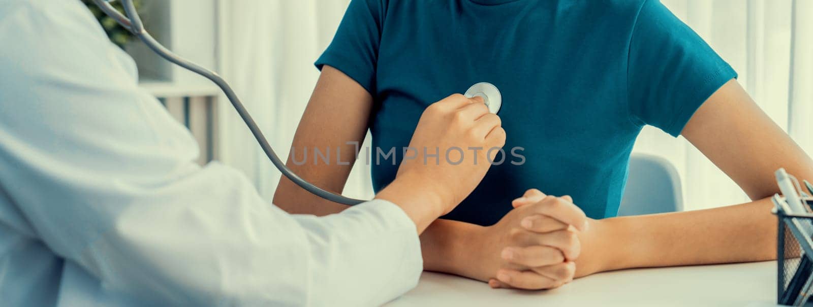 Doctor check patients's pulse with stethoscope in hospital. Rigid by biancoblue